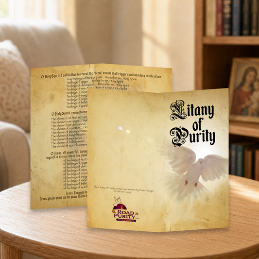 Litany of Purity prayer card displayed in a warm Catholic reading area