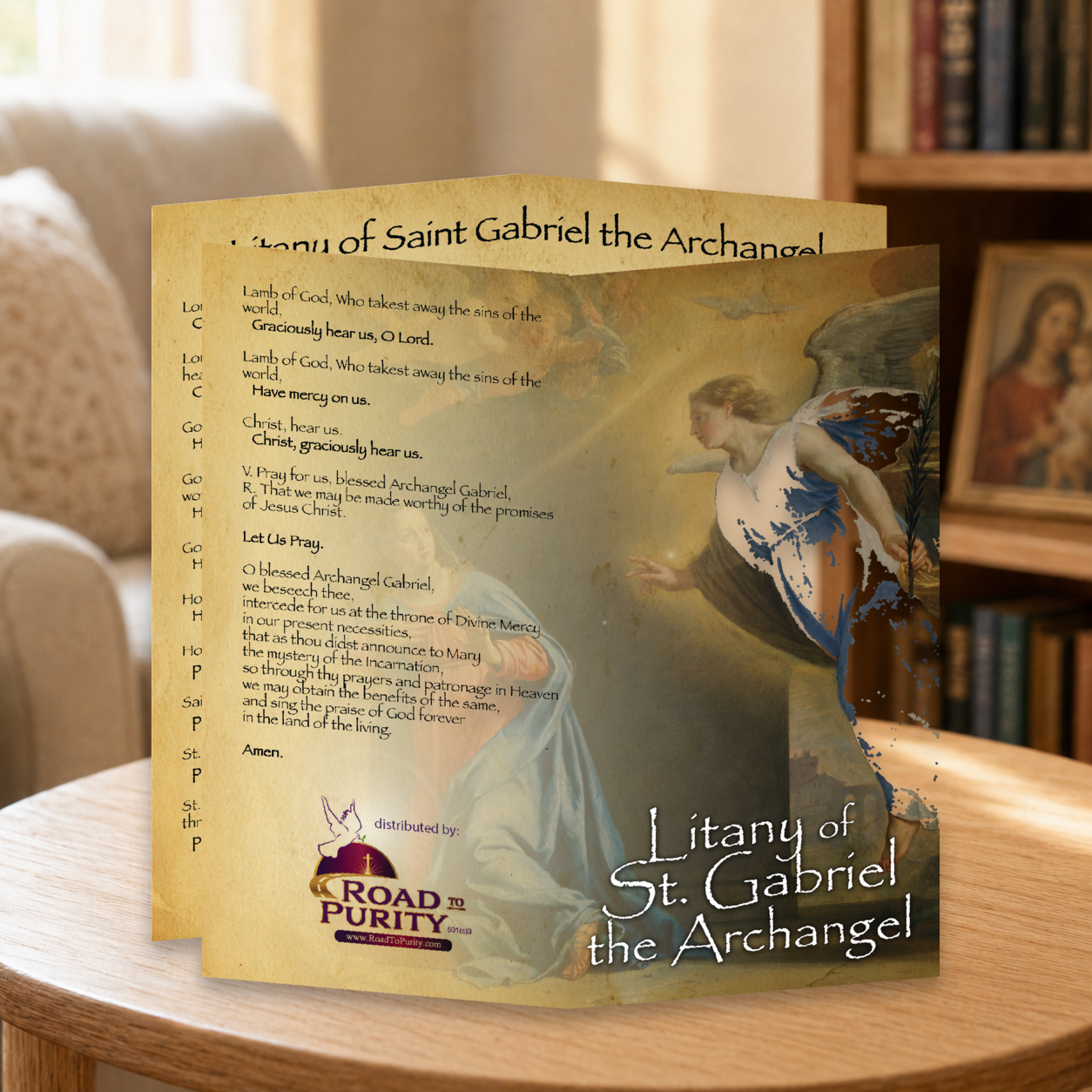 Litany of St Gabriel the Archangel prayer card displayed in a warm Catholic reading area