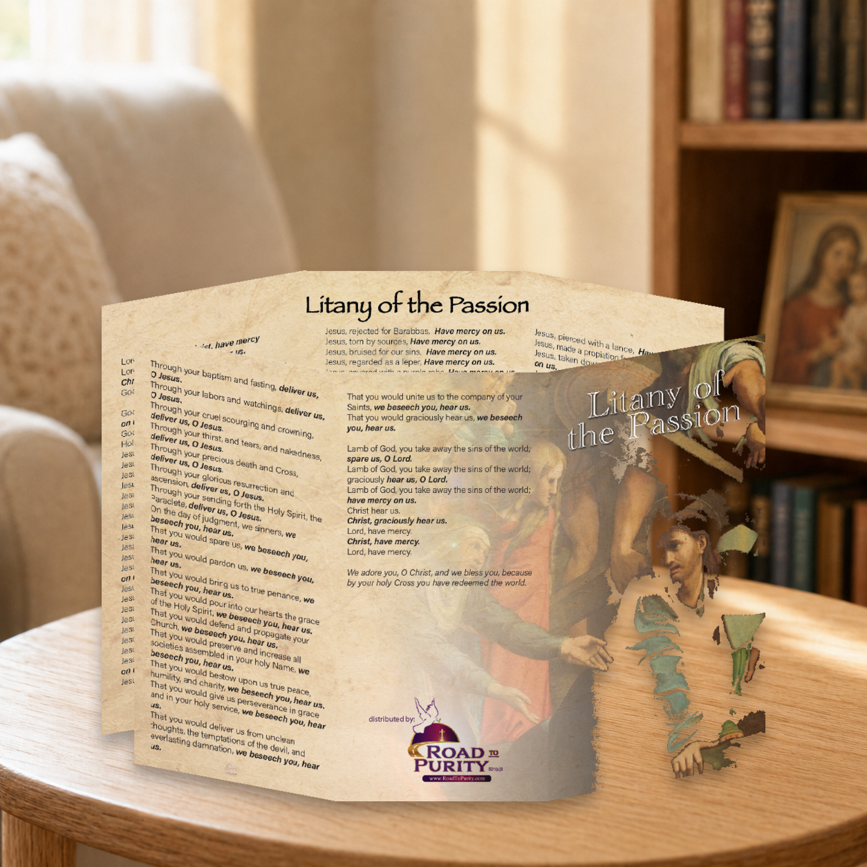 Litany of the Passion prayer card displayed in a warm Catholic reading area